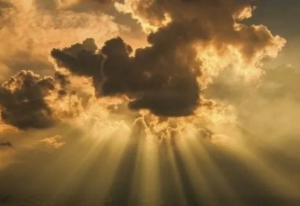 clouds with sun rays shining through image